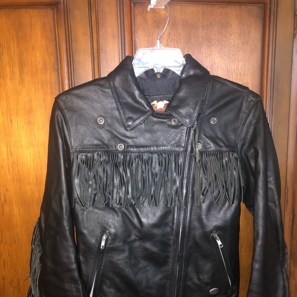 Women’s Harley Davidson leather riding jacket is size Med, with leather fringe.